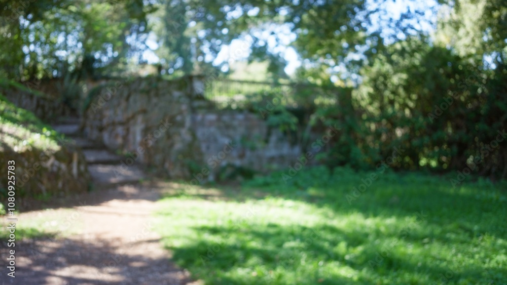 Blurry outdoor view with green foliage and sunlight in villa borghese garden, rome, creating a serene and natural backdrop. Blurry outdoor view with green foliage and sunlight in villa borghese garden, rome, creating a serene and natural backdrop.