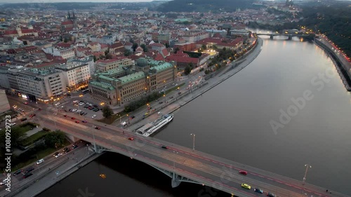 Beautiful Aerial footage of Prague Vltava river, the Ministry of Industry and Trade its ironic streets and buildings and the Old Royal Palace -St. Vitus Cathedral photo