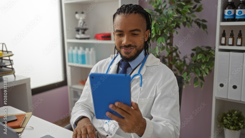 Man wearing white coat using tablet in hospital office with plants, stethoscope, and shelves in background, appearing focused and professional indoors. Man wearing white coat using tablet in hospital office with plants, stethoscope, and shelves in background, appearing focused and professional indoors.