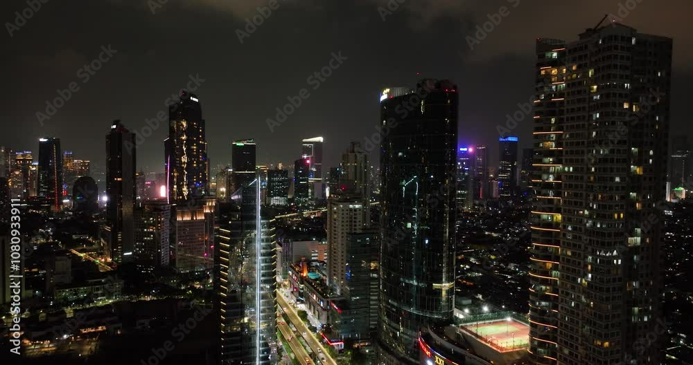 Aerial view of night panorama of Jakarta city with skyscrapers. Aerial view of night panorama of Jakarta city with skyscrapers.