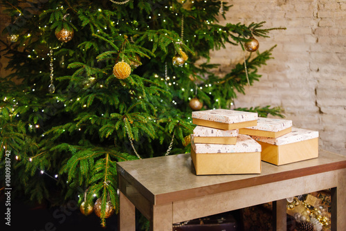 A beautifully decorated and festive Christmas Tree adorned with an array of gift boxes