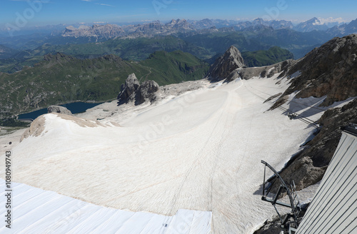 view from over 3000 meters of the marmolada glacier and the cable car arriving photo