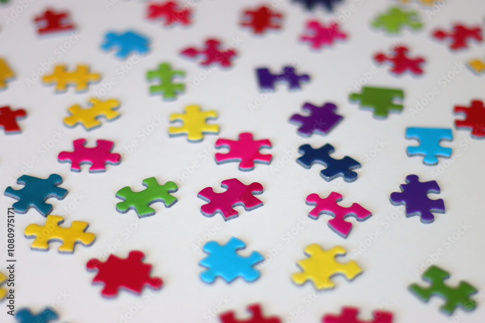 Colorful jigsaw puzzle pieces on white background. Selective focus. Colorful jigsaw puzzle pieces on white background. Selective focus.