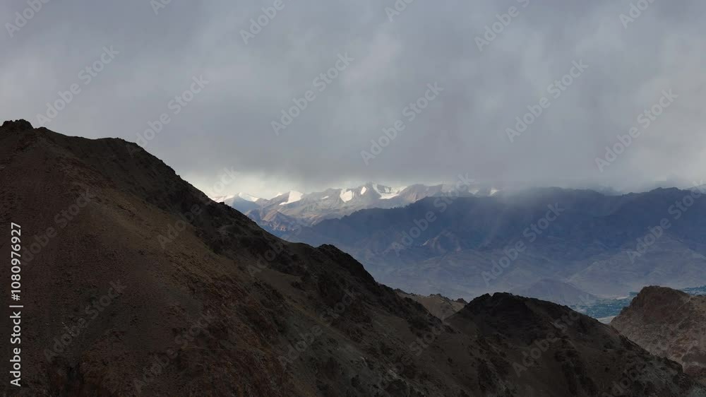 Aerial drone shot of mountains covered in clouds during rain in ladakh Aerial drone shot of mountains covered in clouds during rain in ladakh