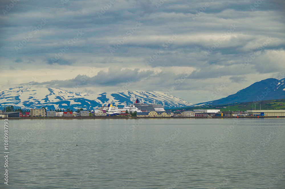 Luxury classic ocean liner cruiseship cruise ship Victoria arrival into Akureyri, Iceland during summer North Sea Arctic Circle cruising landscape coastal scenery Luxury classic ocean liner cruiseship cruise ship Victoria arrival into Akureyri, Iceland during summer North Sea Arctic Circle cruising landscape coastal scenery
