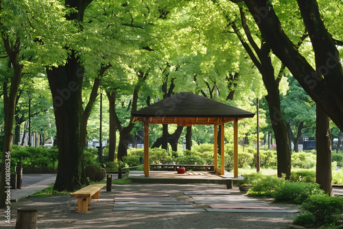 A peaceful gazebo nestled among verdant trees offers a restful retreat in the heart of a park