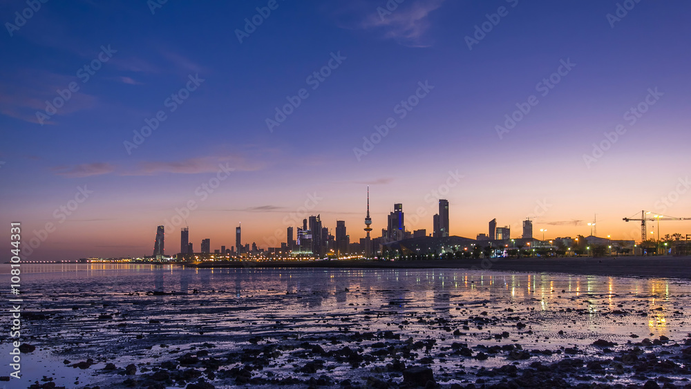 Obraz premium Seaside skyline of Kuwait city from night to day timelapse