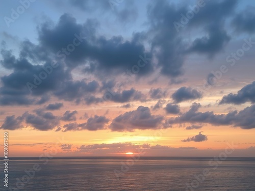 Pastel hues blending into a cloudy sunset over tranquil waters, dusk, sunset, colors