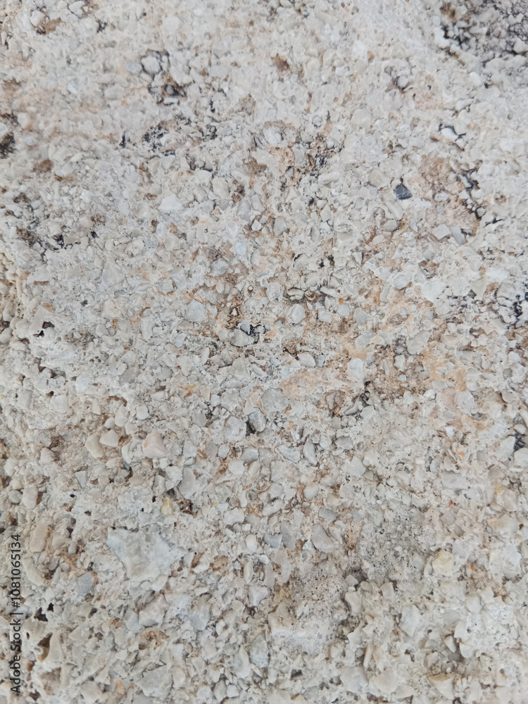 Close-up of natural stone texture with different shades of grey, brown and white. Natural cracks and patterns create a striking and unique texture. Close-up of natural stone texture with different shades of grey, brown and white. Natural cracks and patterns create a striking and unique texture.