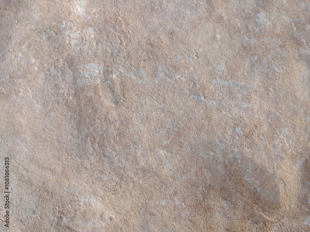 Close-up of natural stone texture with different shades of grey, brown and white. Natural cracks and patterns create a striking and unique texture. Close-up of natural stone texture with different shades of grey, brown and white. Natural cracks and patterns create a striking and unique texture.