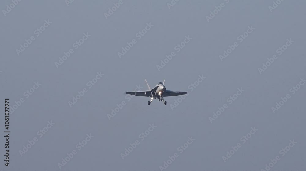 fighter jet making final approach for landing military airbase maneuvering aircraft's agility against backdrop army sunshine front head light aviation precision skillful combat technology 