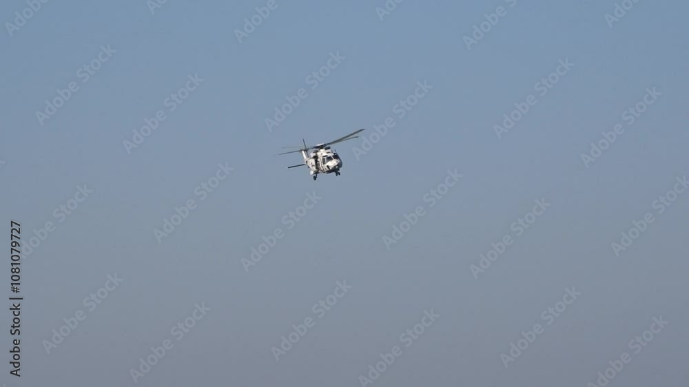 heavy military helicopter weaves through air during high speed flypast agility power display operations dynamic aerial weaving maneuvering aviation aircraft combat 
