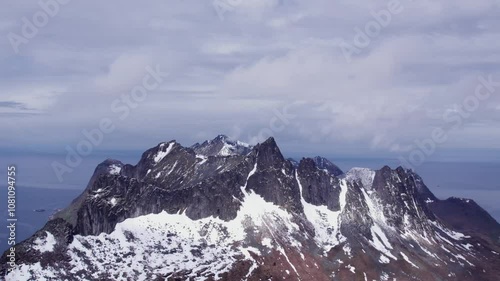 snow covered mountains in winter in norway on senja