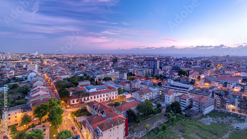 Rooftops of Porto's old town on a warm spring evening timelapse day to night, Porto, Portugal