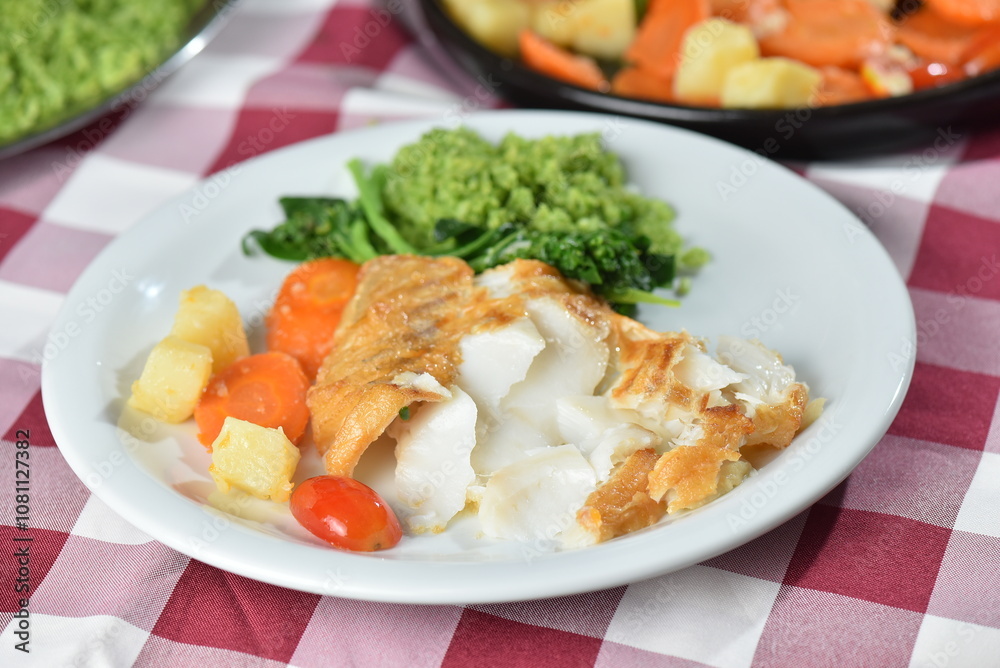 codfish typical Portuguese dish baked cod with onion garlic peppers and potatoes rustic Portuguese food salted fish cooked olive oil codfish typical Portuguese dish baked cod with onion garlic peppers and potatoes rustic Portuguese food salted fish cooked olive oil