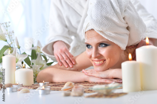 Beautiful woman in spa centar enjoying the massage.