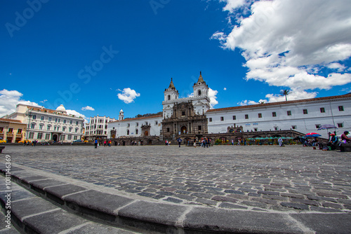 Plaza de San Francisco in the colonial center of the city of Quito on a summer morning. In the background the Church of San Francisco. photo