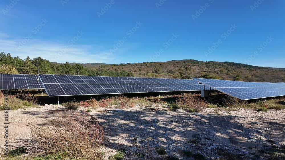 Solar panels on a sunny hillside, embodying renewable energy and sustainability themes Solar panels on a sunny hillside, embodying renewable energy and sustainability themes