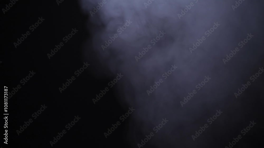 A dense cloud of smoke rolls into the frame from the right, gradually filling the entire view. Slow-motion Full HD video, perfect for use in atmospheric scenes or as a dramatic overlay