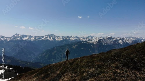 a man hikes in the mountains