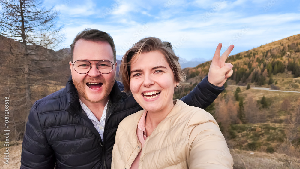 A happy Caucasian couple enjoys an autumn getaway in the mountains, perfect for tourism campaigns and autumn travel promotions A happy Caucasian couple enjoys an autumn getaway in the mountains, perfect for tourism campaigns and autumn travel promotions
