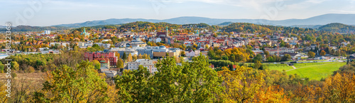 Jelenia Gora, autumn landscape of the city center and the Karkonosze Mountains. View of the city buildings from the Grzybek observation tower on Krzywousty Hill, sunny autumn day. photo