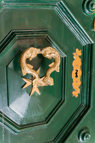 Beautiful door knocker with fish and maltesse cross. Malta photo