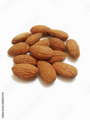 a pile of almonds on white background