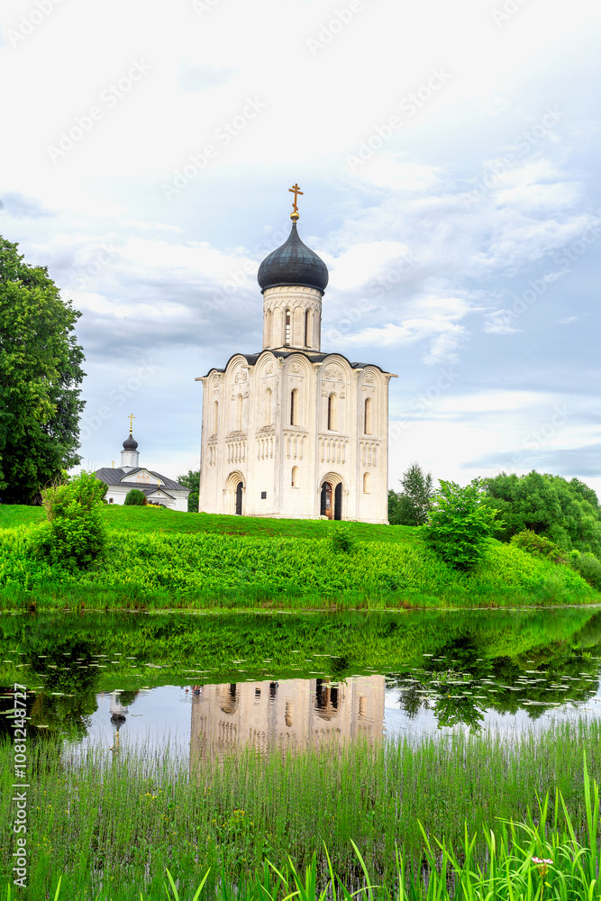 Church of Intercession upon Nerl River 12th century. (Bogolyubovo, Vladimir region, Golden Ring of Russia) A warm summer evening. historical and cultural heritage of Russia. Church of Intercession upon Nerl River 12th century. (Bogolyubovo, Vladimir region, Golden Ring of Russia) A warm summer evening. historical and cultural heritage of Russia.