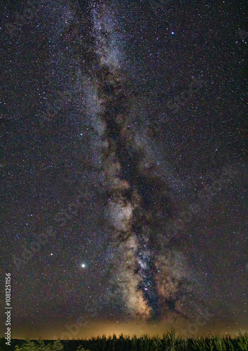 Milky way galaxy photo at night showing the whole milky way on a corn field
