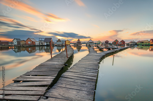 Colorful floating houses on lake Bokod at sunset in Hungary Bokod, Bokodi-tó