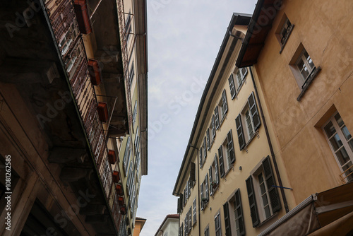 The narrow streets of the old town of Como. Cobblestone and stone streets. photo