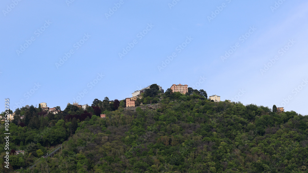 View of the mountaintop with the cable car to Brunate in the city of Como View of the mountaintop with the cable car to Brunate in the city of Como