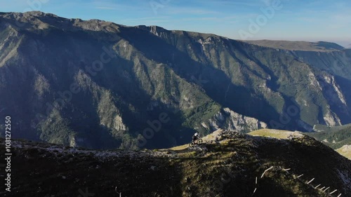 Drone flight over Mountainbiker in the mountains