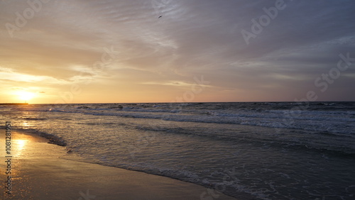 Fototapeta Naklejka Na Ścianę i Meble -  Sunset on the beach by the sea