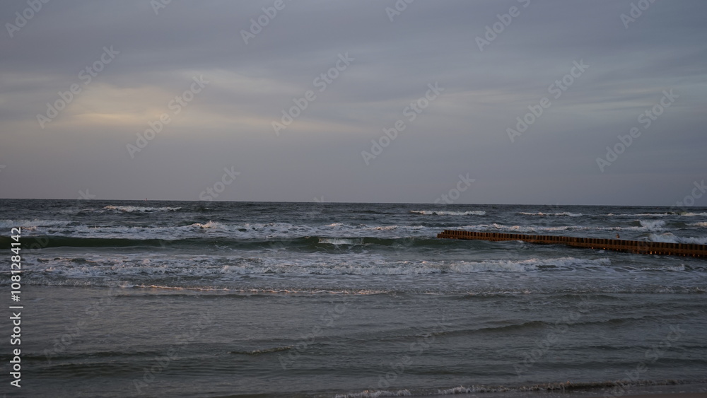 Fototapeta premium Sunset on the beach by the sea