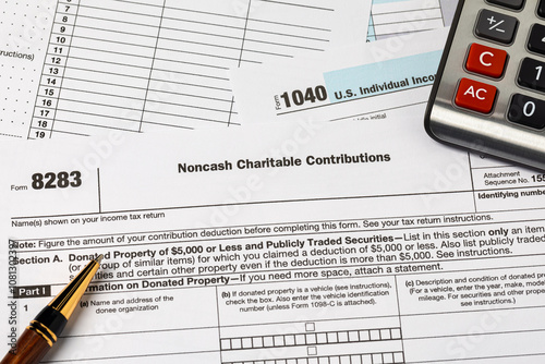 Noncash charitable contribution tax form. Charity donation, deduction and income tax return concept.