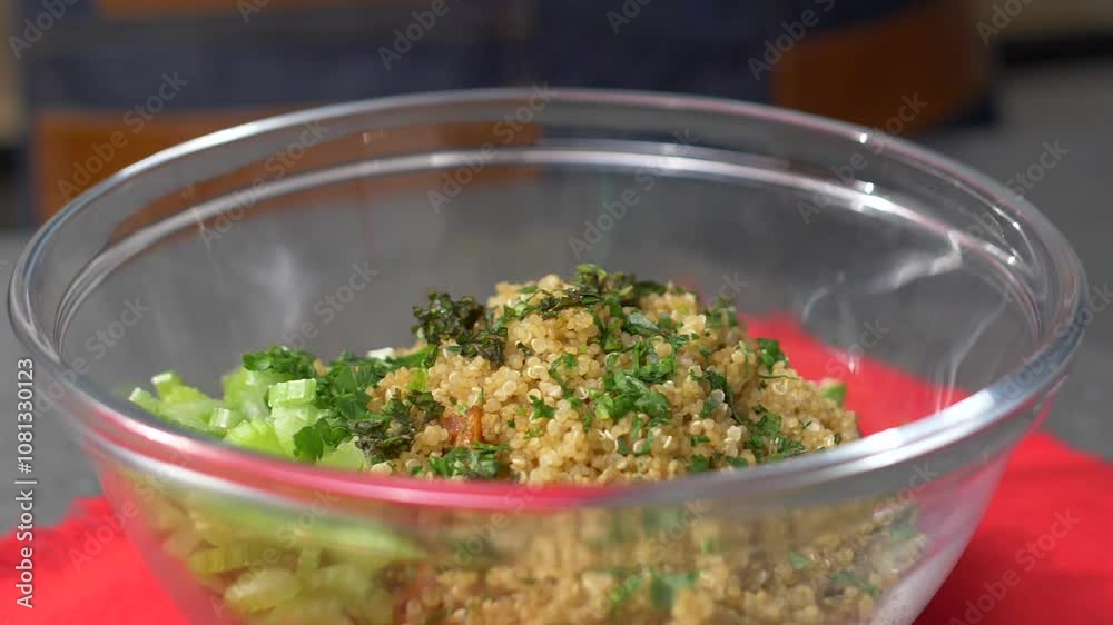 Chef Adding Final Touches to a Fresh Vegetable Salad, Sprinkling Cilantro in Slow Motion Over a Transparent Bowl with Couscous, Celery, and Tomato, Showcasing a Quick and Simple Homemade Dish Chef Adding Final Touches to a Fresh Vegetable Salad, Sprinkling Cilantro in Slow Motion Over a Transparent Bowl with Couscous, Celery, and Tomato, Showcasing a Quick and Simple Homemade Dish
