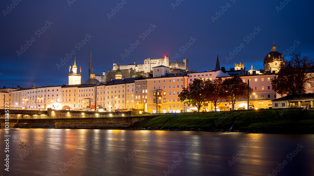 Fototapeta premium Salzburg city evening view. Cathedral, Old Town Altstadt, Hohensalzburg castle illuminated at night.