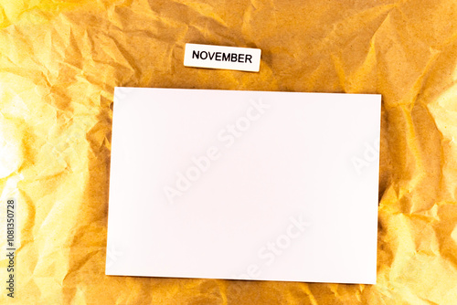 blank sheet of paper and yellow november page list of plans for meetings and events for the month november