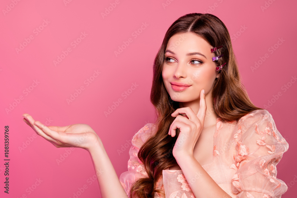 Gorgeous pretty girl holding beauty product cosmetics introduce seasonal offer empty space over pink color background Gorgeous pretty girl holding beauty product cosmetics introduce seasonal offer empty space over pink color background