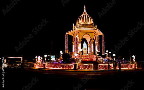 A Dramatic evening view of the brightly Illuminated Maharaja Memorial architecture near Mysore palace during Dasara festival in Karnataka, India.