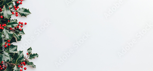 wallpaper with holly leaves and red fruit on the edge