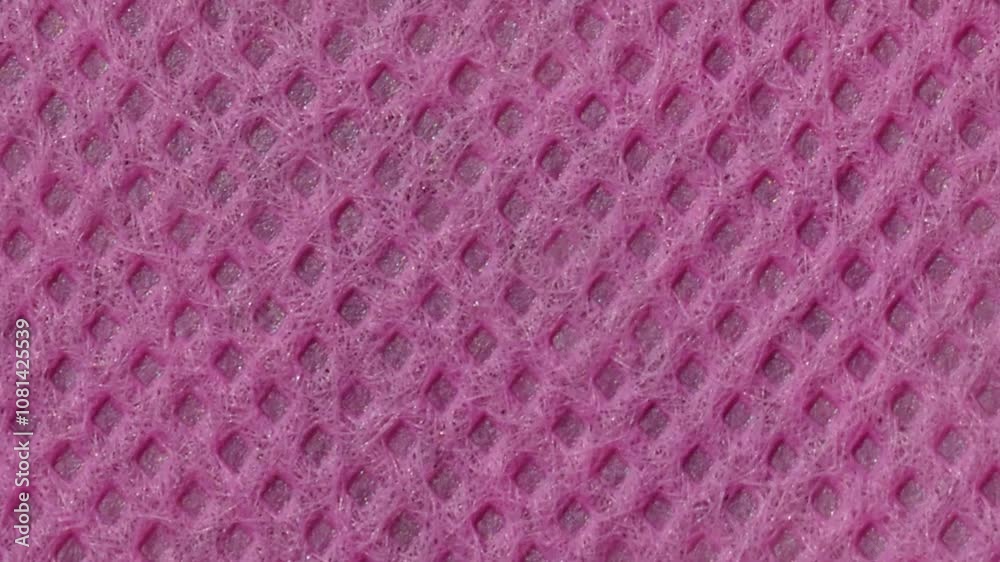 surface texture background of the purple non-woven fabric is rough and porous. polypropylene fabric surface texture background of the purple non-woven fabric is rough and porous. polypropylene fabric