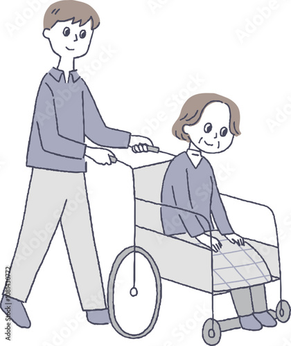 車椅子を押す男性