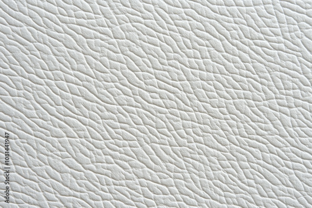 The image is a close up of a white leather texture The image is a close up of a white leather texture