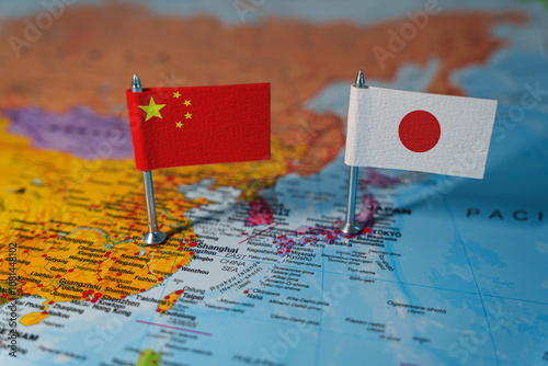China and Japan flags on world map