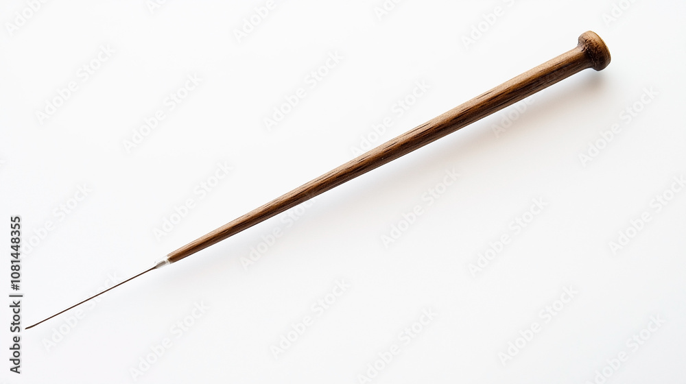 A wooden stick with a pointed end A wooden stick with a pointed end