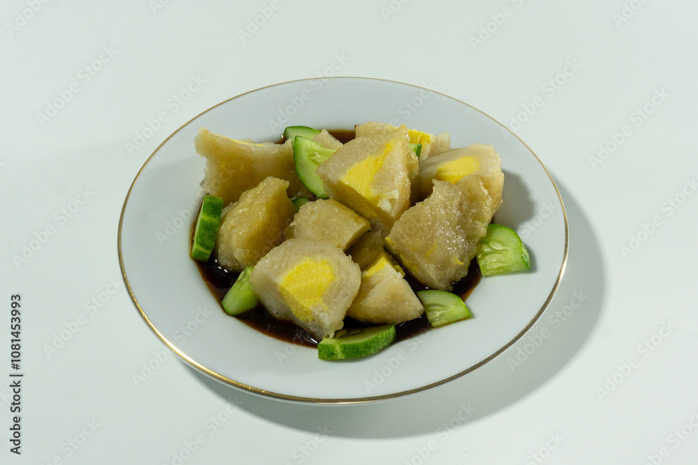 Pempek or mpek-mpek is a delicacy from Palembang, South Sumatra. It is made of fish and sago flours and served together with a dark, rich sauce called cuko. Pempek or mpek-mpek is a delicacy from Palembang, South Sumatra. It is made of fish and sago flours and served together with a dark, rich sauce called cuko.