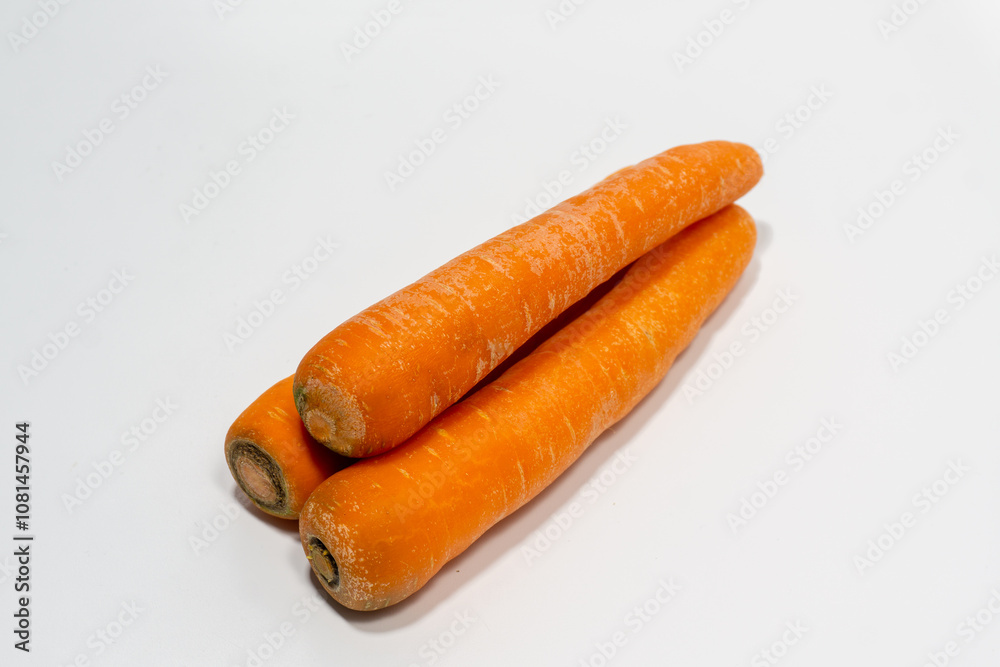Carrots isolated. Carrot on white background. Three carrots. Full depth of field. Carrots isolated. Carrot on white background. Three carrots. Full depth of field.